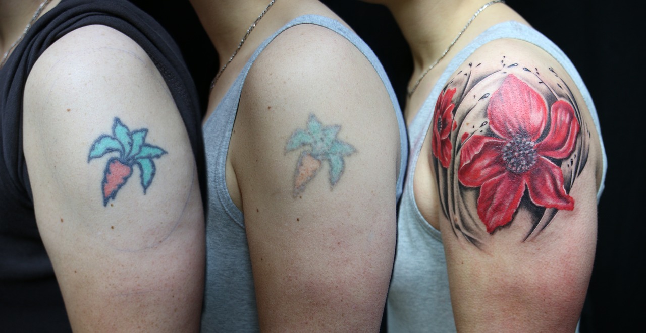 Different tattoos on top forearm.